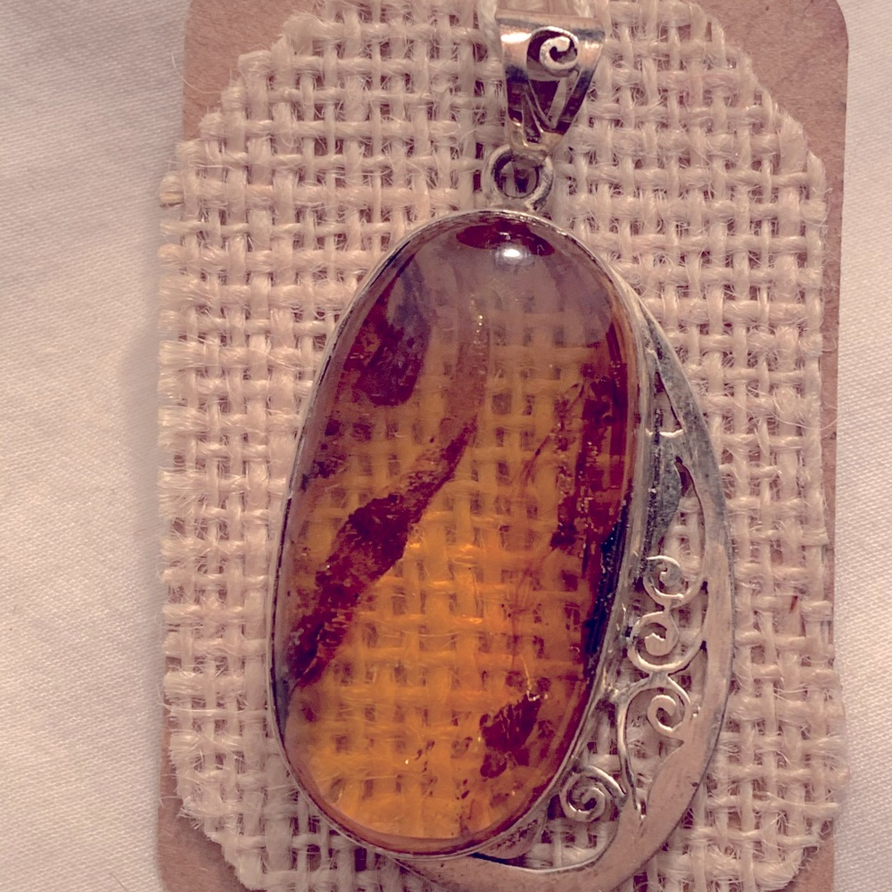 Handmade sterling silver set on authentic amber